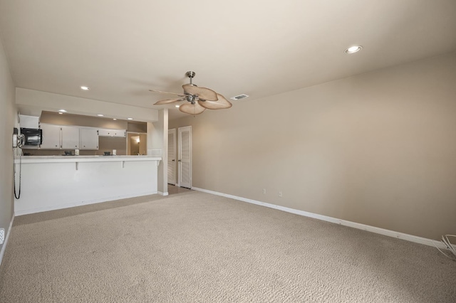 1702 W Bullard Unit 105, Fresno, CA 93711 - unfurnished living room with a ceiling fan, recessed lighting, and light colored carpet