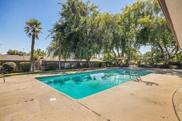 1702 W Bullard Unit 105, Fresno, CA 93711 - community pool featuring a patio and a fenced backyard