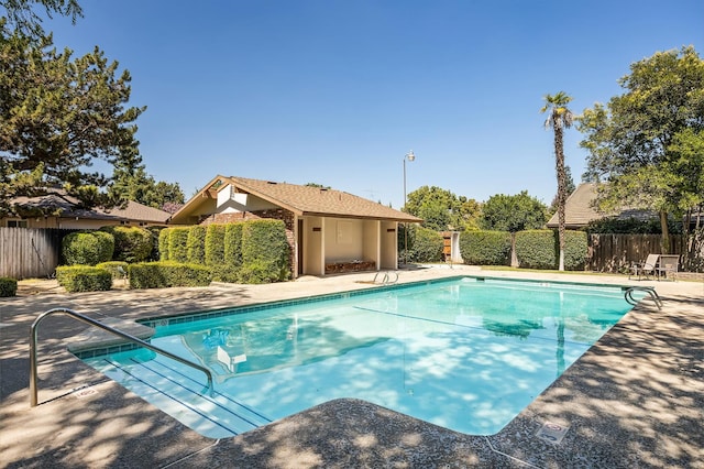 1702 W Bullard Unit 105, Fresno, CA 93711 - community pool featuring a patio area