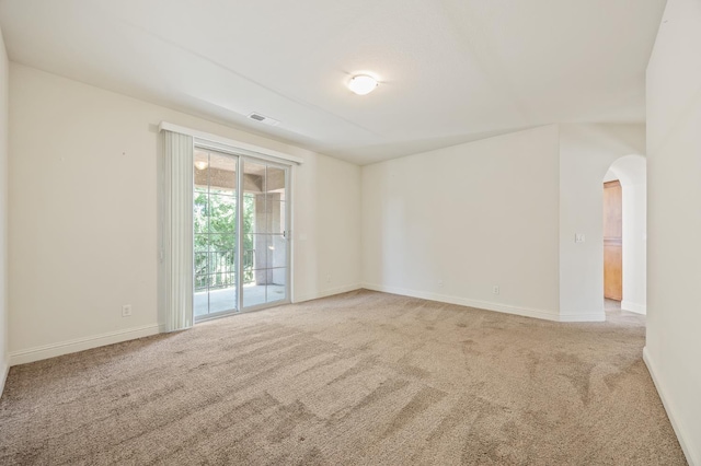 5929 N La Paz Ave, Fresno, CA 93723 - carpeted spare room featuring arched walkways and baseboards