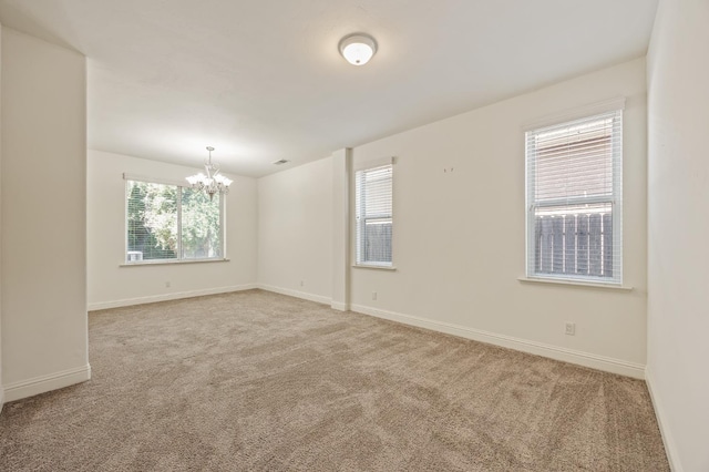 5929 N La Paz Ave, Fresno, CA 93723 - empty room with a chandelier and light carpet