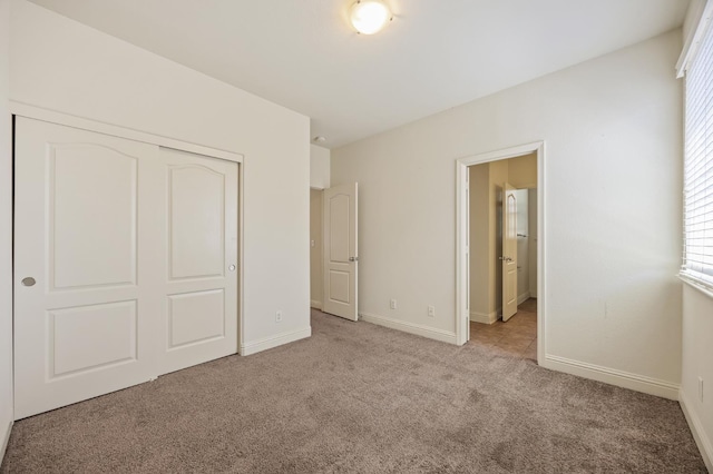 5929 N La Paz Ave, Fresno, CA 93723 - unfurnished bedroom with carpet flooring, multiple windows, and a closet