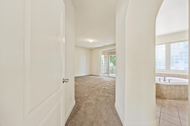 5929 N La Paz Ave, Fresno, CA 93723 - hallway with light colored carpet and baseboards
