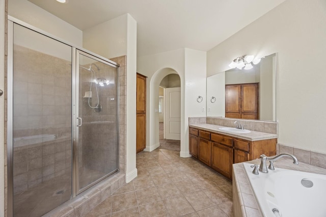5929 N La Paz Ave, Fresno, CA 93723 - full bath featuring a stall shower, a whirlpool tub, vanity, and tile patterned flooring