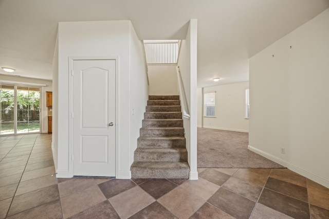 5929 N La Paz Ave, Fresno, CA 93723 - stairs with baseboards and carpet floors