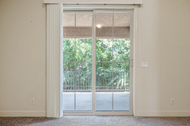 5929 N La Paz Ave, Fresno, CA 93723 - doorway to outside featuring carpet and plenty of natural light