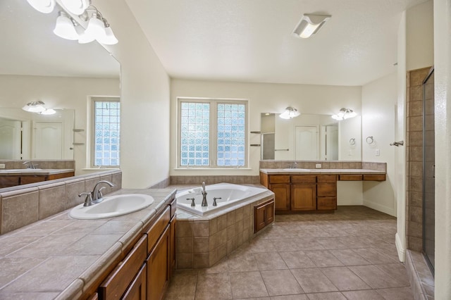 5929 N La Paz Ave, Fresno, CA 93723 - bathroom with a garden tub, two vanities, a stall shower, and tile patterned floors