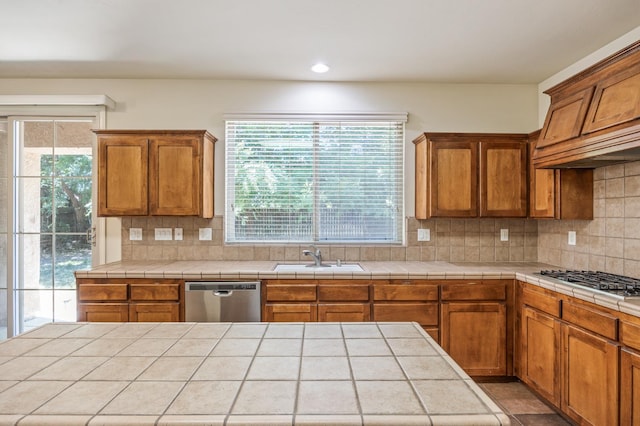 5929 N La Paz Ave, Fresno, CA 93723 - kitchen featuring stainless steel appliances, tasteful backsplash, brown cabinets, recessed lighting, and custom exhaust hood