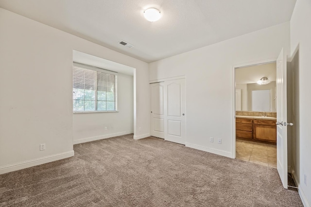 5929 N La Paz Ave, Fresno, CA 93723 - unfurnished bedroom with light colored carpet and a closet
