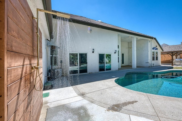 218 W Hubert Ct, Fresno, CA 93711 - back of house featuring stucco siding, a patio, an outdoor pool, and ceiling fan