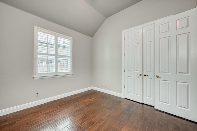 218 W Hubert Ct, Fresno, CA 93711 - unfurnished bedroom with lofted ceiling, dark wood-style flooring, and a closet