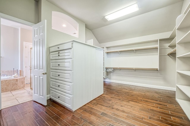218 W Hubert Ct, Fresno, CA 93711 - spacious closet featuring dark wood-type flooring and vaulted ceiling