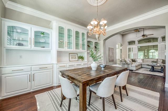 218 W Hubert Ct, Fresno, CA 93711 - dining room featuring arched walkways, ceiling fan, dark wood-style flooring, ornamental molding, and a chandelier