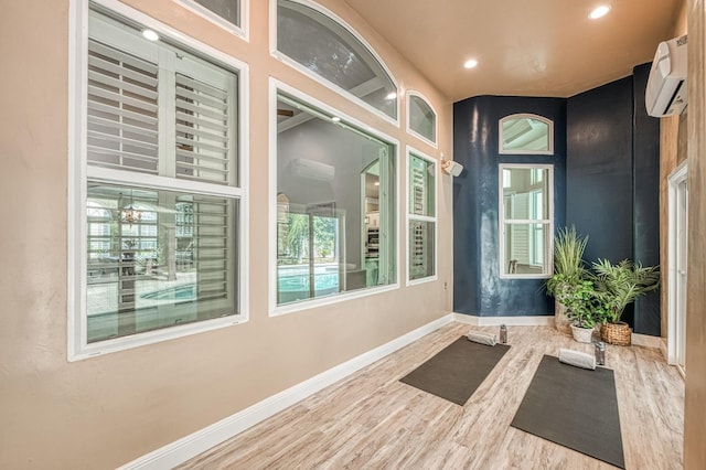 218 W Hubert Ct, Fresno, CA 93711 - workout room featuring a wall mounted air conditioner, wood finished floors, and recessed lighting