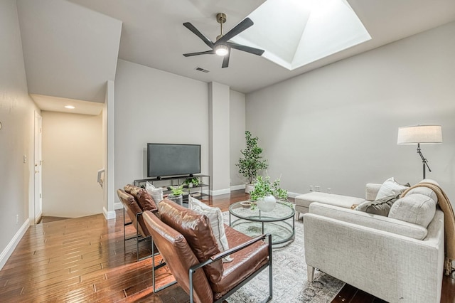 218 W Hubert Ct, Fresno, CA 93711 - living area with wood finished floors, ceiling fan, and a skylight