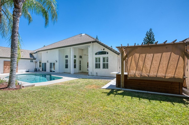 218 W Hubert Ct, Fresno, CA 93711 - rear view of property with stucco siding, a lawn, and a patio area