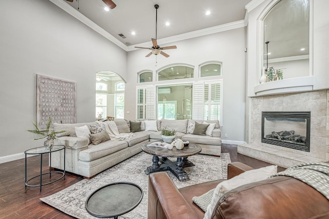 218 W Hubert Ct, Fresno, CA 93711 - living area featuring ceiling fan, dark wood-type flooring, healthy amount of natural light, a towering ceiling, and ornamental molding