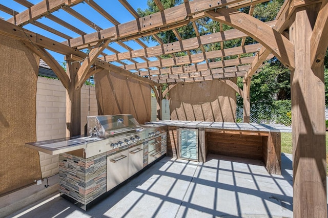 218 W Hubert Ct, Fresno, CA 93711 - view of patio / terrace featuring a pergola and an outdoor kitchen