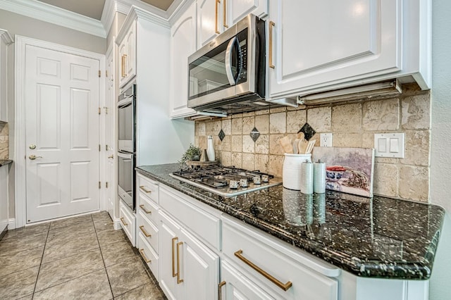 218 W Hubert Ct, Fresno, CA 93711 - kitchen featuring appliances with stainless steel finishes, crown molding, white cabinetry, decorative backsplash, and dark stone counters