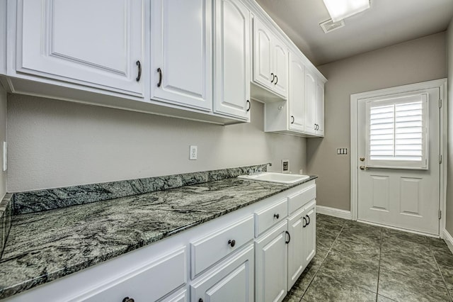 218 W Hubert Ct, Fresno, CA 93711 - laundry room with hookup for a washing machine and cabinet space