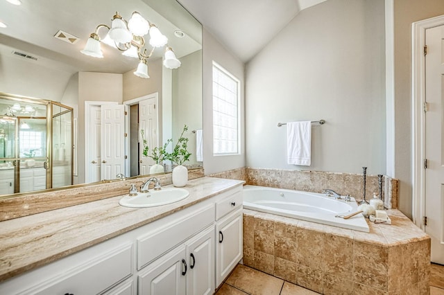 218 W Hubert Ct, Fresno, CA 93711 - bathroom with vanity, a bath, lofted ceiling, a shower stall, and tile patterned floors