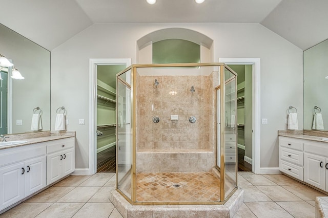 218 W Hubert Ct, Fresno, CA 93711 - full bath with lofted ceiling, vanity, a spacious closet, a shower stall, and tile patterned floors