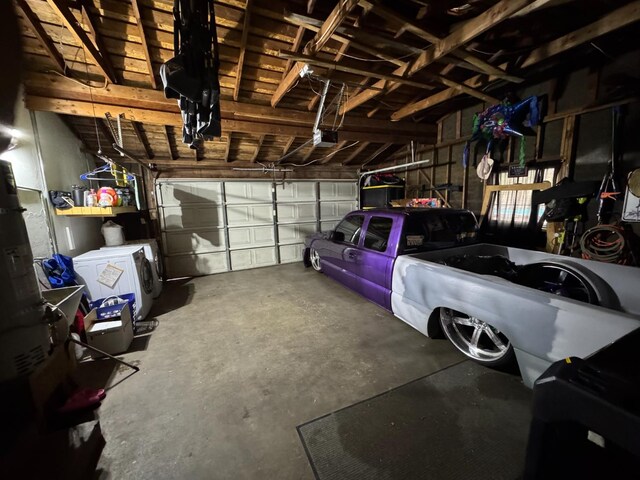 4615 E Hamilton Ave E, Fresno, CA 93702 - garage featuring a garage door opener and washer / dryer
