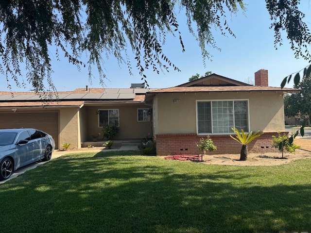 4615 E Hamilton Ave E, Fresno, CA 93702 - ranch-style house featuring stucco siding, solar panels, a garage, a front lawn, and a chimney