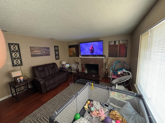 4615 E Hamilton Ave E, Fresno, CA 93702 - living area with a textured ceiling and wood finished floors