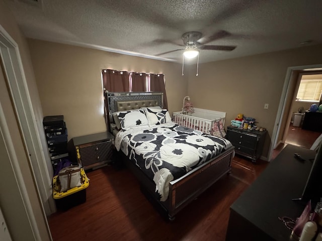 4615 E Hamilton Ave E, Fresno, CA 93702 - bedroom with dark wood-style floors, a textured ceiling, and a ceiling fan
