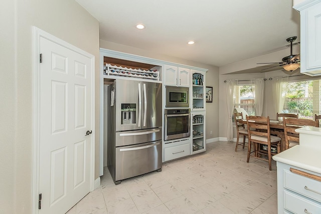 4950 W Minarets Ave, Fresno, CA 93722 - kitchen with appliances with stainless steel finishes, a ceiling fan, recessed lighting, white cabinets, and light countertops