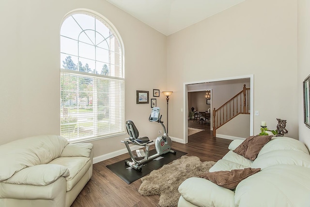 4950 W Minarets Ave, Fresno, CA 93722 - living room with a high ceiling, wood finished floors, and stairs