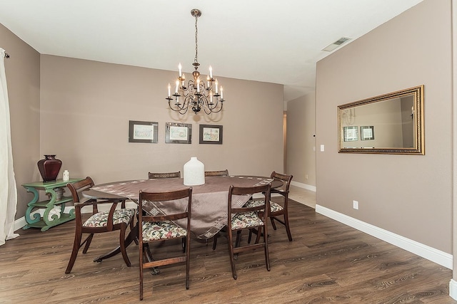 4950 W Minarets Ave, Fresno, CA 93722 - dining area with a chandelier and wood finished floors