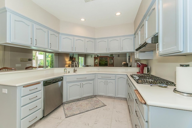 4950 W Minarets Ave, Fresno, CA 93722 - kitchen featuring appliances with stainless steel finishes, under cabinet range hood, light marble finish flooring, light countertops, and recessed lighting