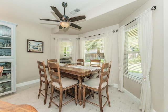 4950 W Minarets Ave, Fresno, CA 93722 - dining space with ceiling fan and light marble finish flooring