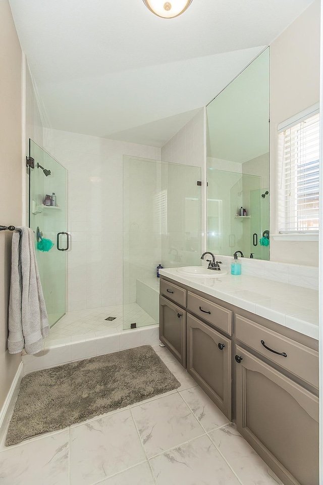 4950 W Minarets Ave, Fresno, CA 93722 - bathroom featuring vanity, a shower stall, and marble finish floors