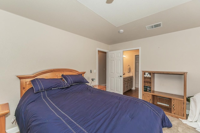 4950 W Minarets Ave, Fresno, CA 93722 - bedroom with connected bathroom and baseboards