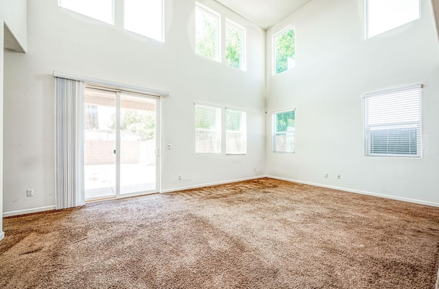 2354 S Garden, Fresno, CA 93725 - carpeted spare room featuring a towering ceiling and plenty of natural light