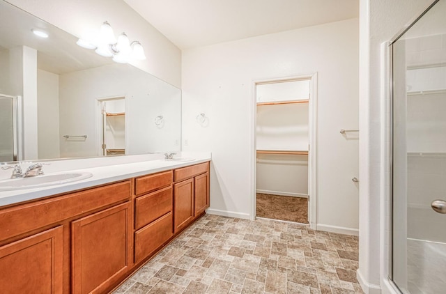 2354 S Garden, Fresno, CA 93725 - full bath featuring a walk in closet, double vanity, and a stall shower