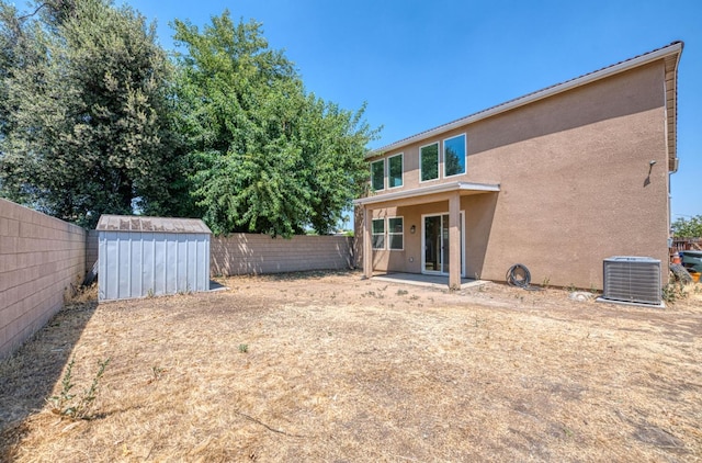 2354 S Garden, Fresno, CA 93725 - back of house with a fenced backyard, a shed, stucco siding, and a patio