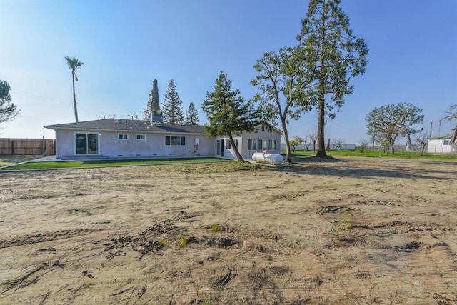 5942 S Cedar Ave, Fresno, CA 93725 - back of house featuring stucco siding