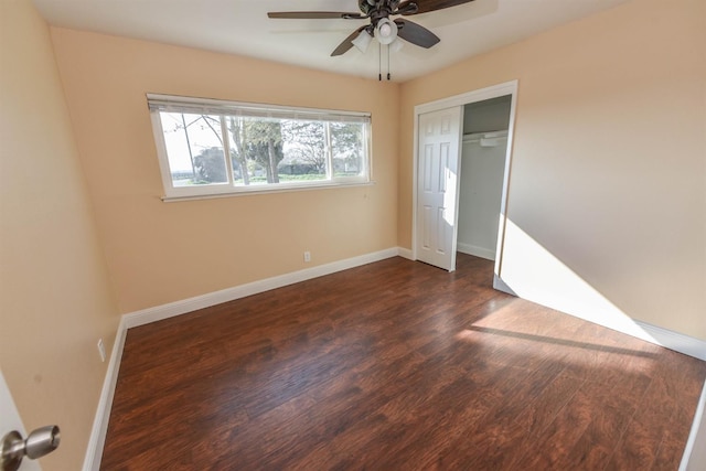 5942 S Cedar Ave, Fresno, CA 93725 - unfurnished bedroom featuring dark wood-style flooring, a closet, and a ceiling fan