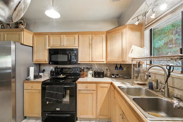 36358 Orange Grove Ave, Madera, CA 93636 - kitchen featuring black appliances, light brown cabinets, and decorative backsplash