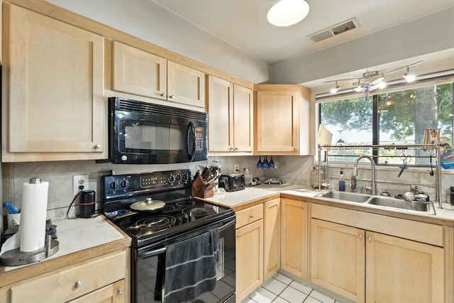 36358 Orange Grove Ave, Madera, CA 93636 - kitchen featuring black appliances, light brown cabinetry, light countertops, decorative backsplash, and light tile patterned floors