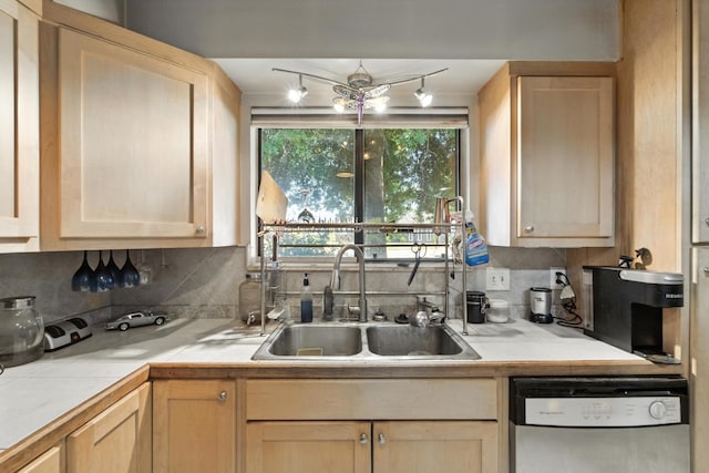 36358 Orange Grove Ave, Madera, CA 93636 - kitchen with stainless steel dishwasher, light brown cabinetry, and backsplash