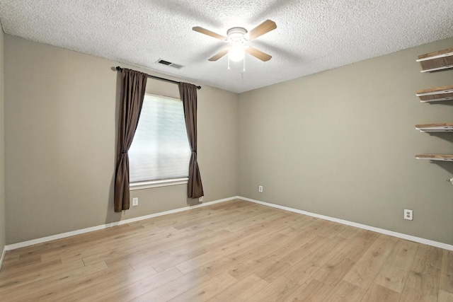 36358 Orange Grove Ave, Madera, CA 93636 - empty room with a ceiling fan, a textured ceiling, and light wood finished floors