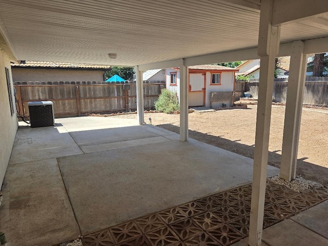 6173 N Marty Ave, Fresno, CA 93711 - fenced backyard with a patio area and a storage shed