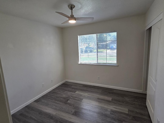 6173 N Marty Ave, Fresno, CA 93711 - unfurnished bedroom featuring dark wood-style flooring, a closet, and ceiling fan