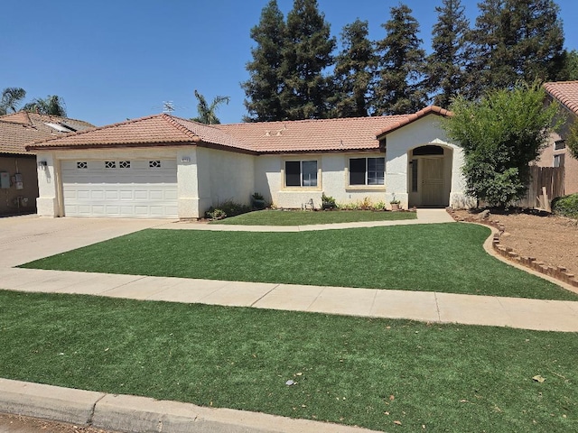 6173 N Marty Ave, Fresno, CA 93711 - view of front of home with a tiled roof, stucco siding, an attached garage, and driveway