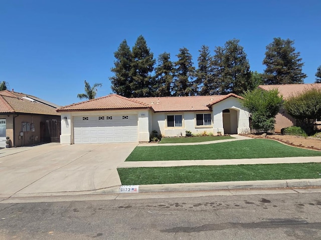6173 N Marty Ave, Fresno, CA 93711 - single story home with a tile roof, stucco siding, a garage, and concrete driveway